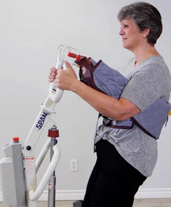 F500S sit-to-stand lift in assisted-living bedroom setting